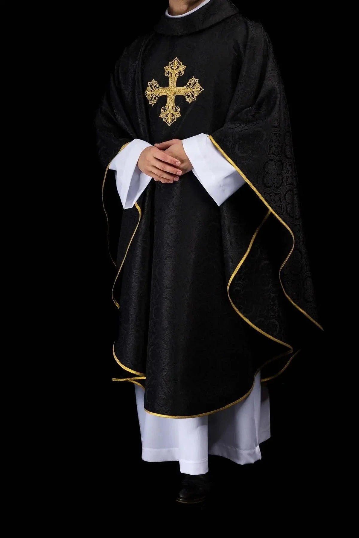 Black chasubles with embroidered liturgical motifs