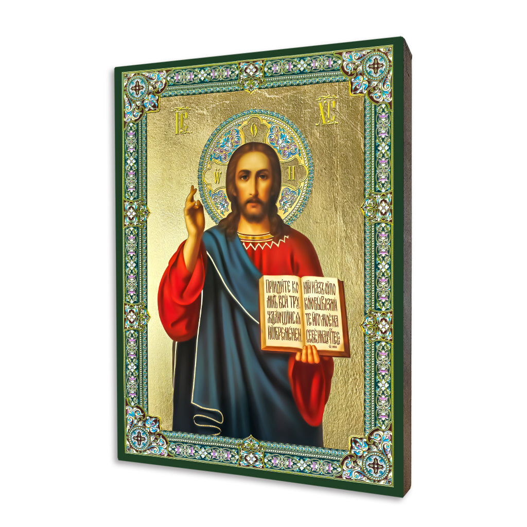 Traditional religious icon of Jesus Christ Pantocrator holding an open Gospel, featured on a gold-leafed linden wood panel with an ornate border.