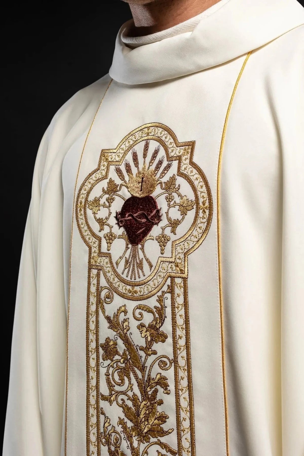 Sacred Heart medallion and neckline detail on an ecru chasuble