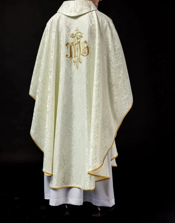 Ecru Chasuble with IHS embroidery on decorative fabric — close-up detail
