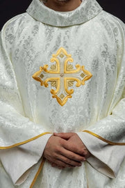 Ecru Chasuble with embroidered cross on patterned fabric — front view