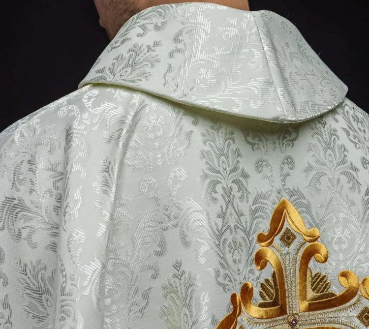 Ecru Chasuble with embroidered cross on patterned fabric — side view