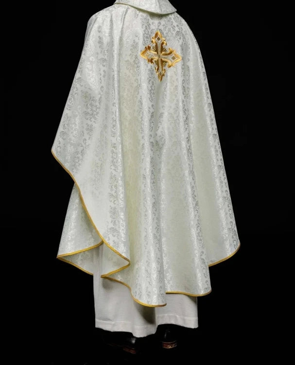 Ecru Chasuble with embroidered cross on patterned fabric — fabric detail