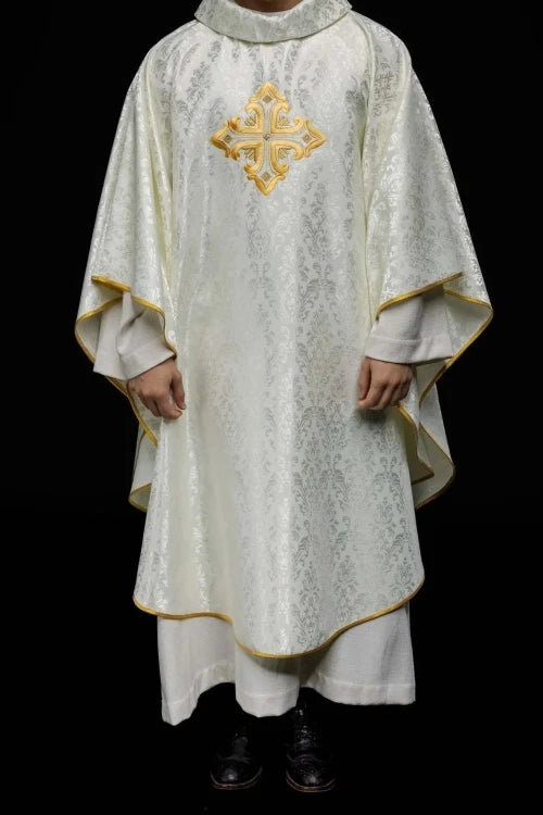 Ecru Chasuble with embroidered cross on patterned fabric — vestment detail