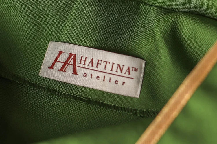 Green Chasuble with Alpha and Omega embroidery — close-up detail