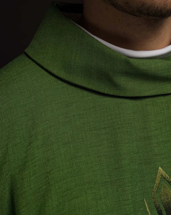Green Chasuble with embroidered cross — close-up detail