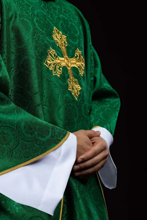 Green Chasuble with embroidered cross on patterned fabric — close-up detail