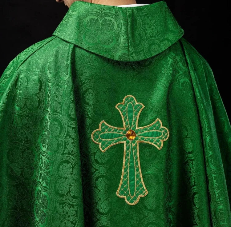 Green Chasuble with embroidered cross symbol — close-up detail