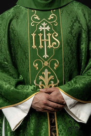 Green Chasuble with IHS embroidery on decorative fabric — front view