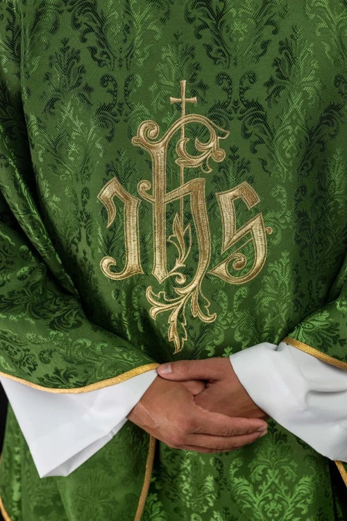 Green Chasuble with IHS embroidery on decorative fabric — decoration detail