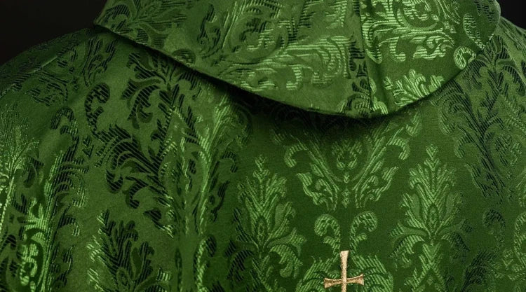 Green Chasuble with IHS embroidery on decorative fabric — side view
