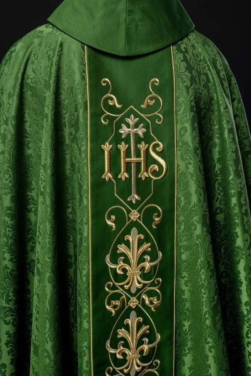 Green Chasuble with IHS embroidery on decorative fabric — fabric detail