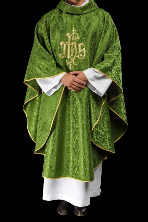 Green Chasuble with IHS embroidery on decorative fabric — vestment detail