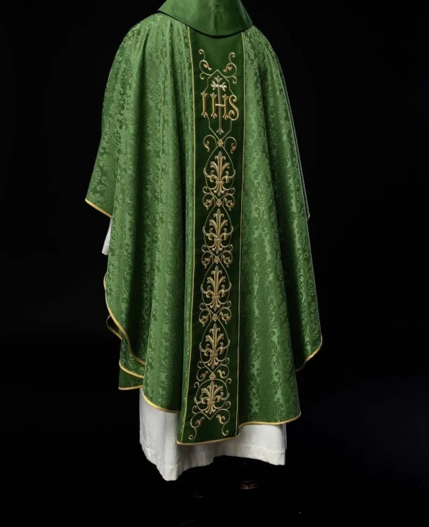 Green Chasuble with IHS embroidery on decorative fabric — vestment detail