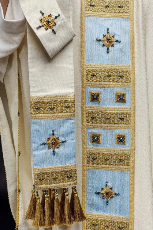Ecru Chasuble with hand-applied Marian decoration with natural stones — fabric detail