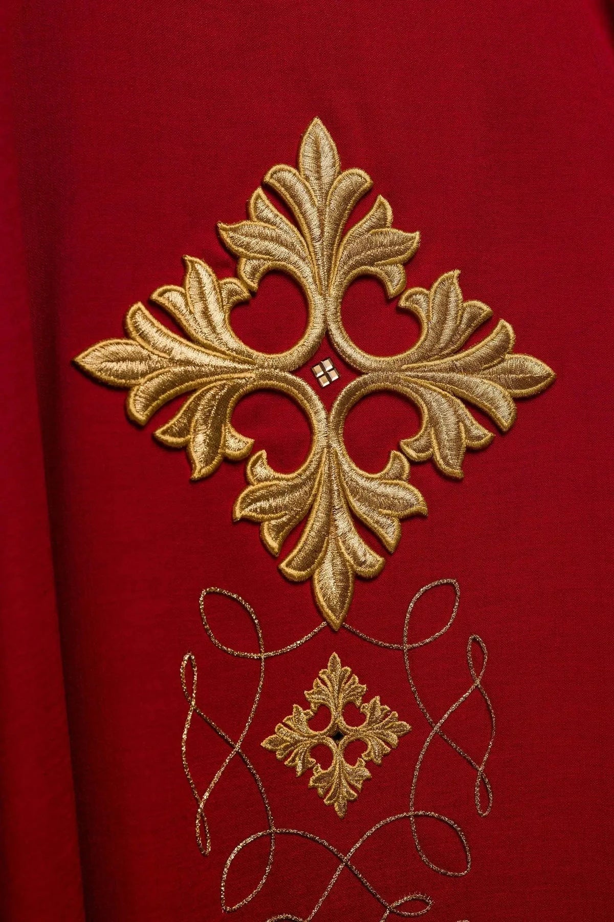 Richly Embroidered Red Chasuble with Cord and Decorative Stones — fabric detail