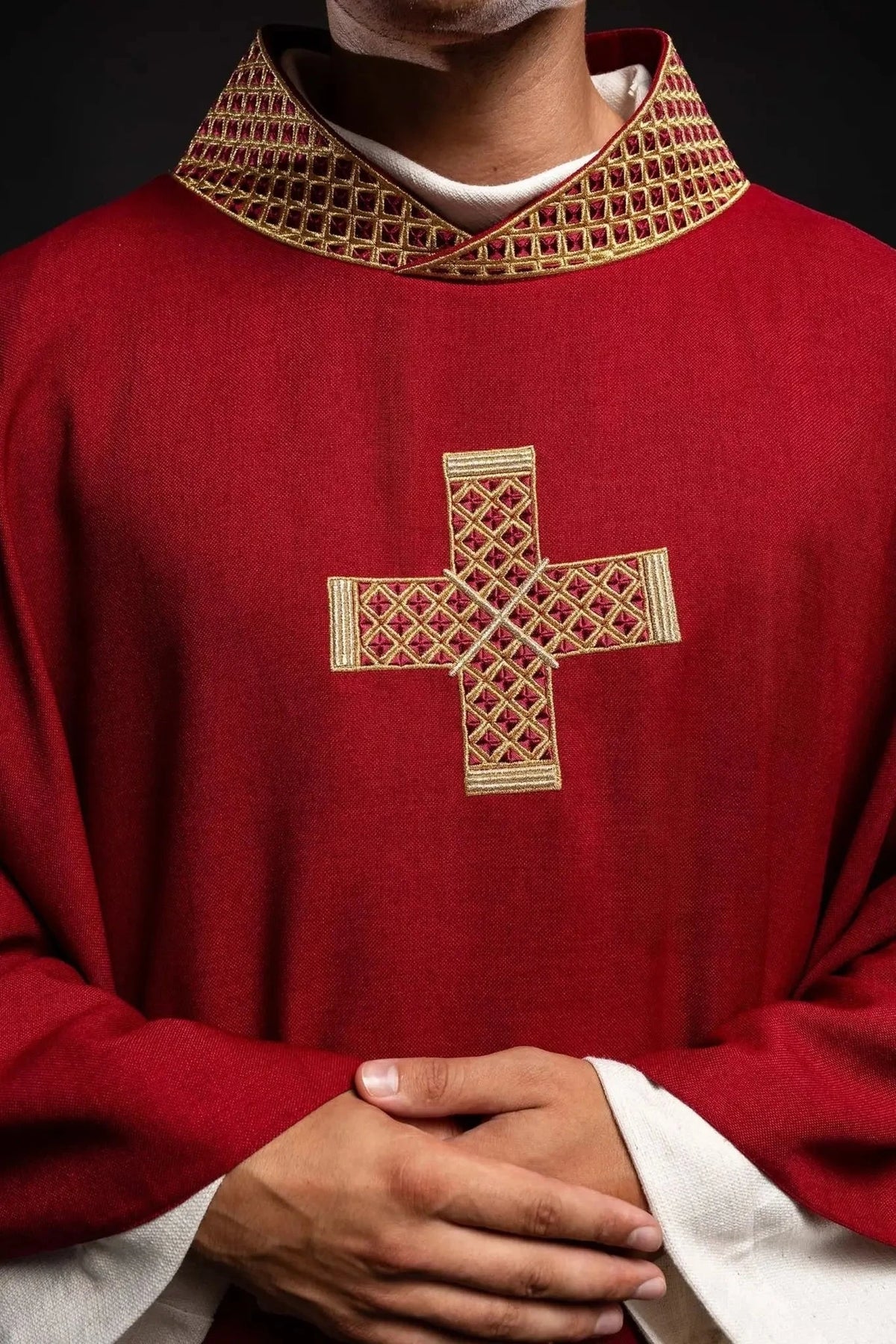 Red chasuble with gold cross embroidery — embroidery close-up