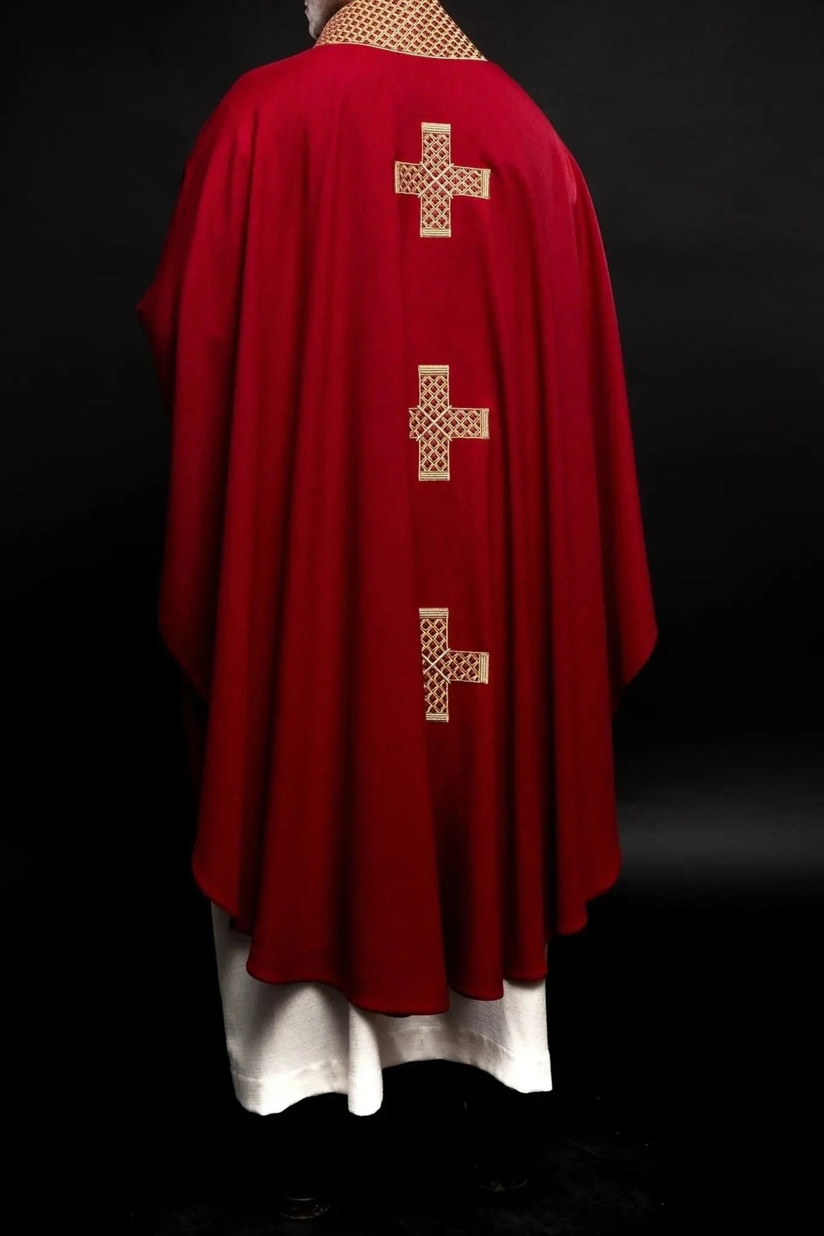 Red chasuble with gold cross embroidery — front view