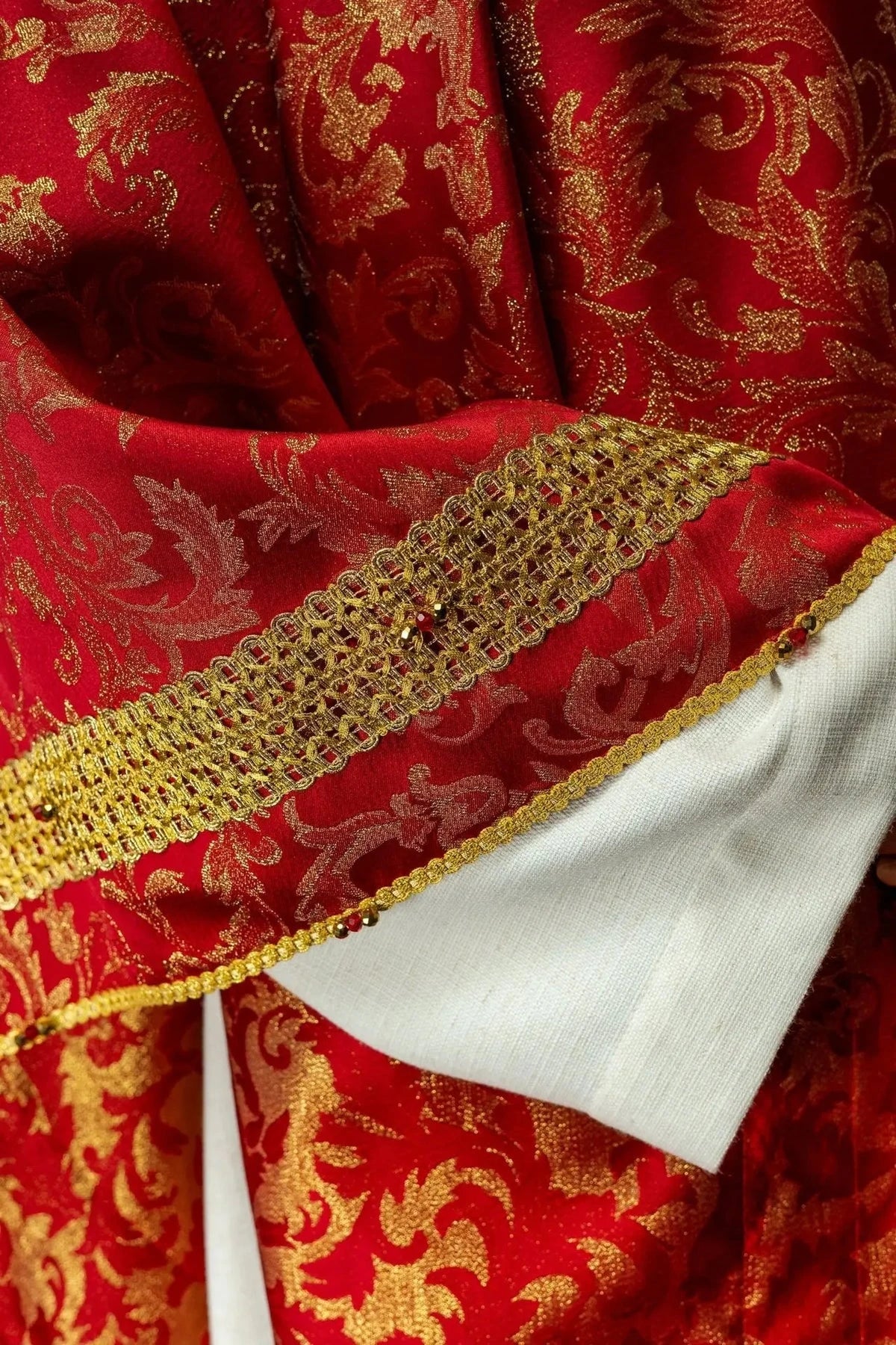 Red Chasuble with Natural Stone Decoration — symbol detail