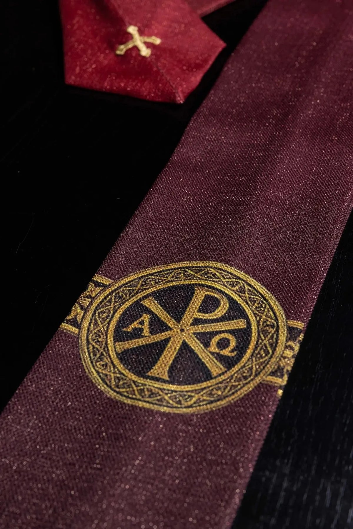 Red chasuble with PAX print — detail view
