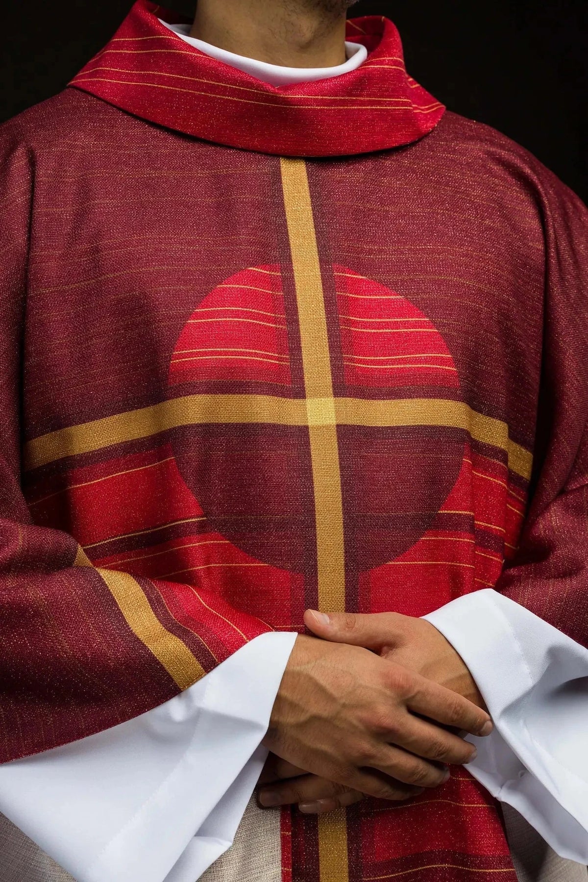Red chasuble with printed cross — print close-up