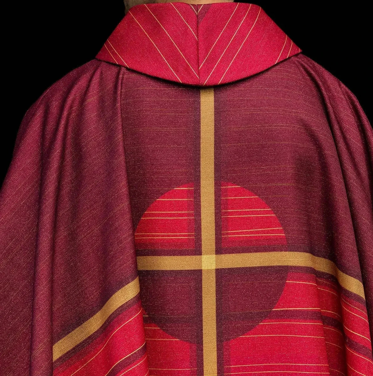 Red chasuble with printed cross — back view