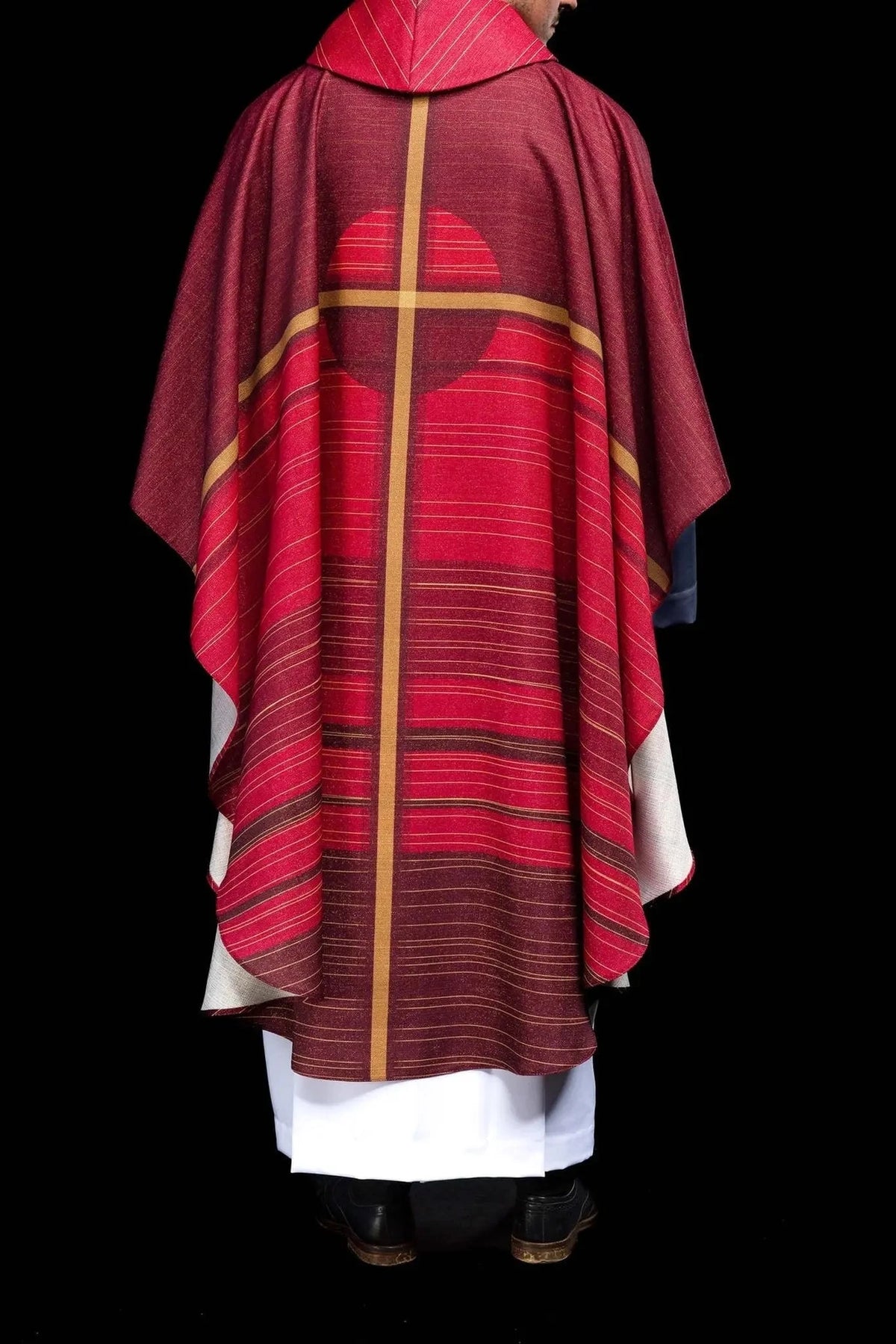 Red chasuble with printed cross — surface detail