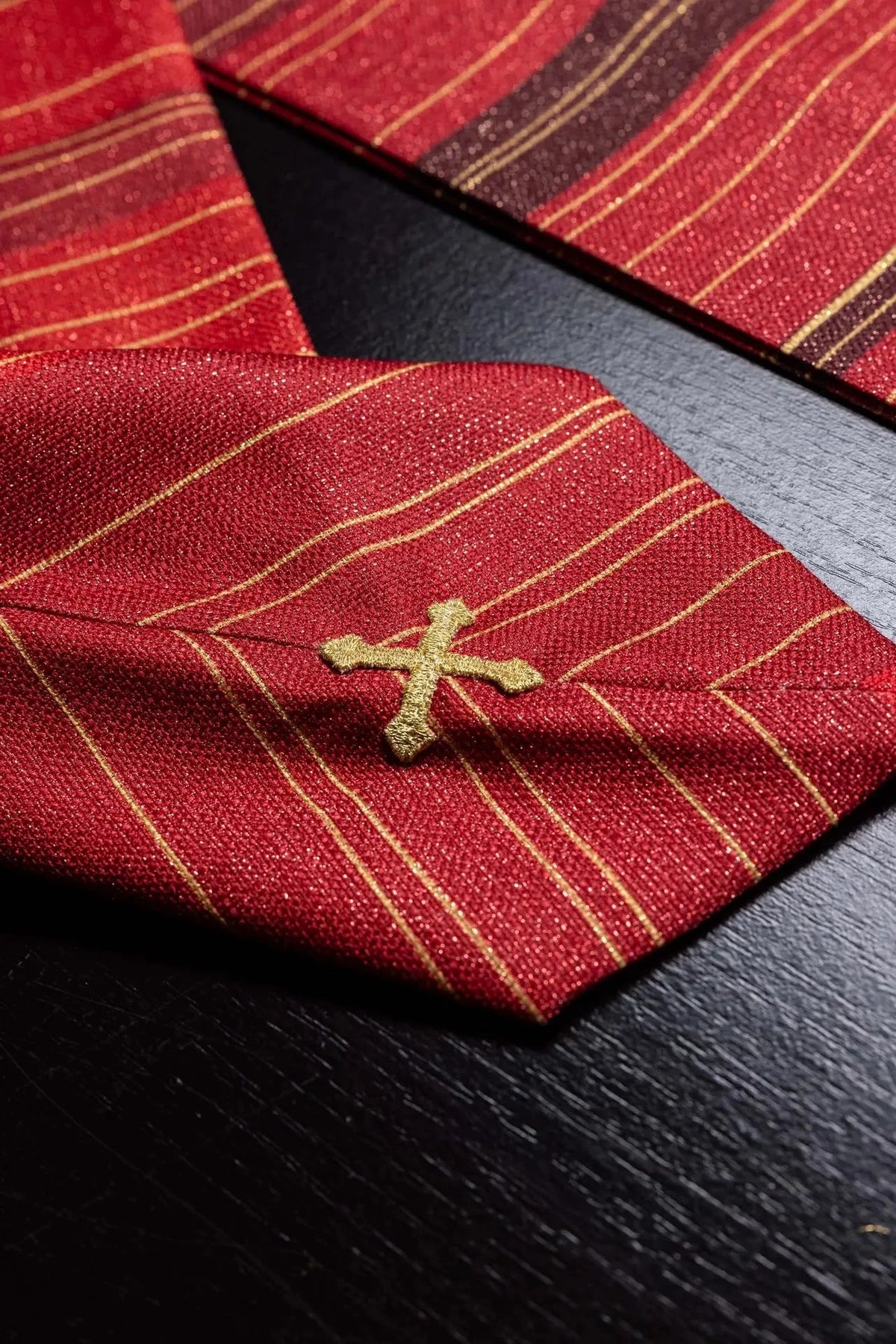 Red chasuble with printed Jerusalem Cross — decorative detail
