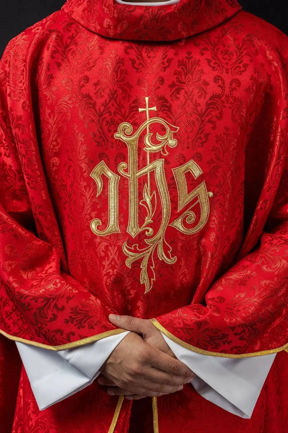 Red Chasuble with IHS Embroidery on Decorative Fabric — embroidery close-up