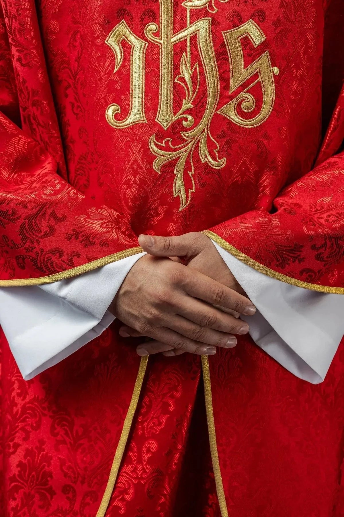 Red Chasuble with IHS Embroidery on Decorative Fabric — symbol detail