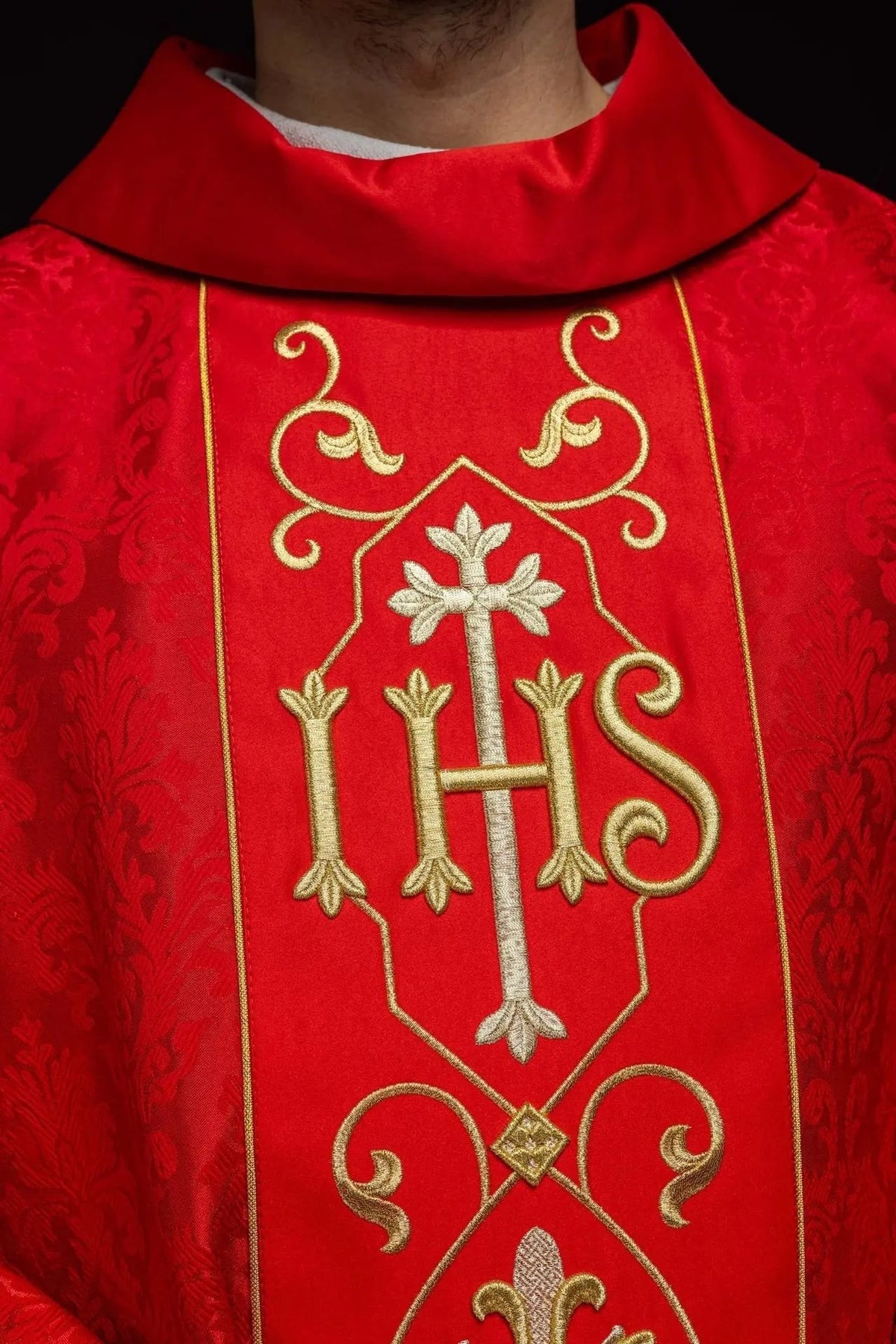 Red Chasuble with IHS Embroidery on Ornamental Fabric — embroidery close-up