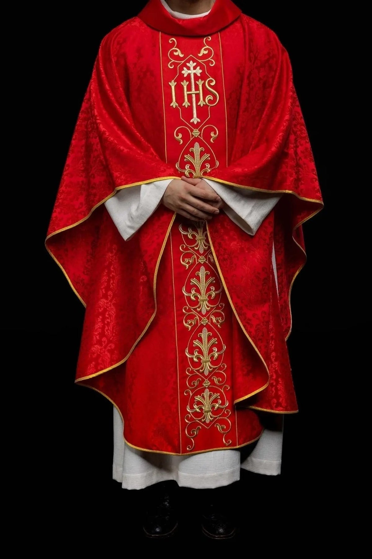 Red Chasuble with IHS Embroidery on Ornamental Fabric — fabric detail