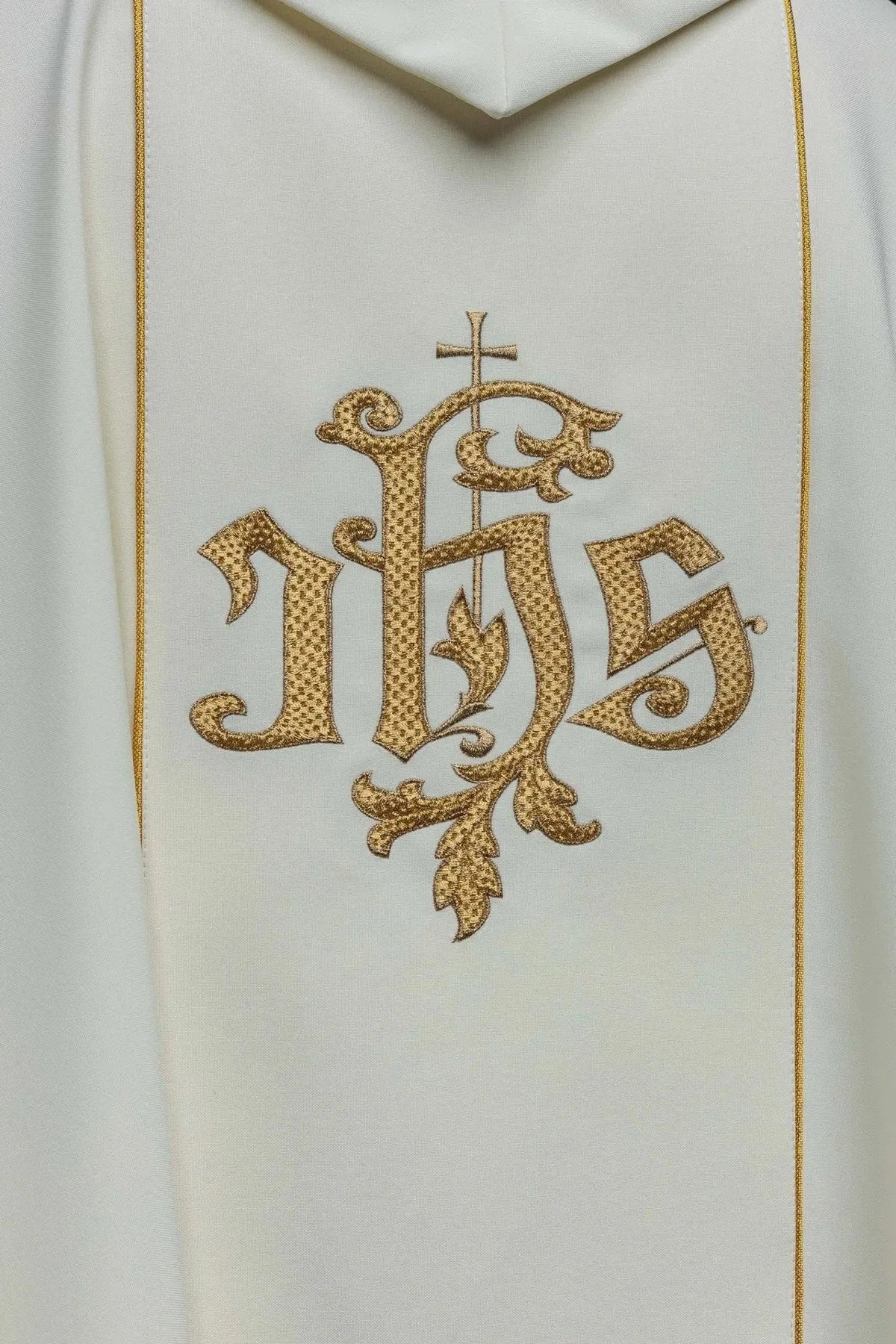 IHS monogram on the back of the ecru chasuble